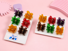 Assorted butterfly hair claw clips on a display card