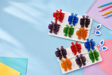 Assorted butterfly hair claw clips in a display set