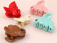 Leaf-shaped hair claw clips in rose tones
