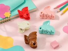 Leaf-shaped hair claw clips in rose tones