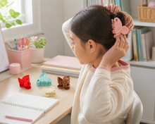 Leaf-shaped hair claw clips in rose tones