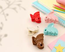 Leaf-shaped hair claw clips in rose tones