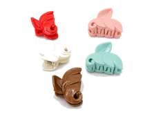Leaf-shaped hair claw clips in rose tones
