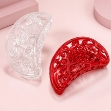 Curved barrette hair clips in red and clear finishes